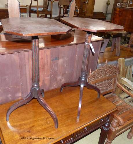 A pair of Regency style octagonal mahogany tripod wine table...