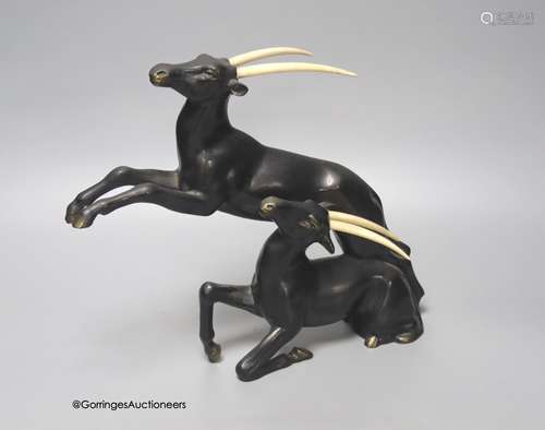 A painted bronzed spelter and ivorine antelope, in the style...