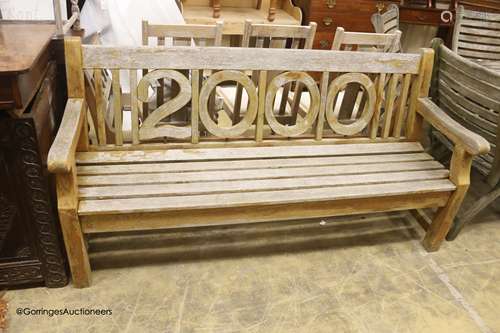 An Alexander Rose Millenium teak garden bench, length 182cm,...