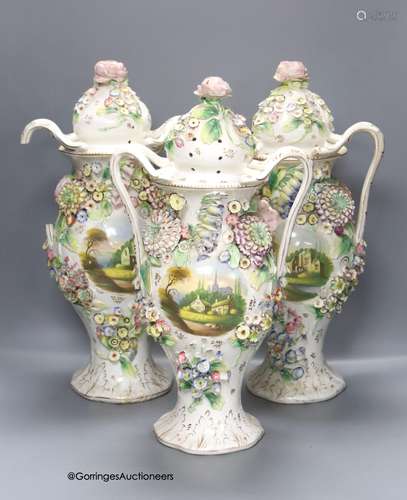 A set of three Coalbrookdale style vases and covers, height ...