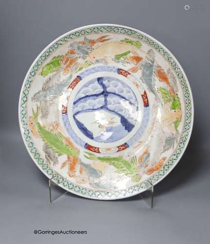 A 19th century Japanese Imari charger,decorated in pale colo...