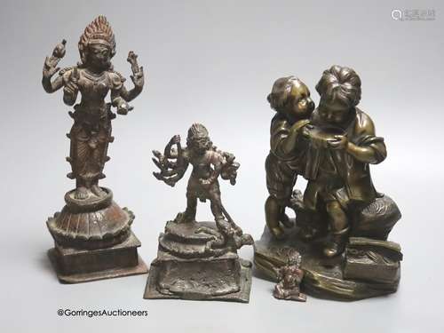 A bronze group of two children and two Indian bronze figures...