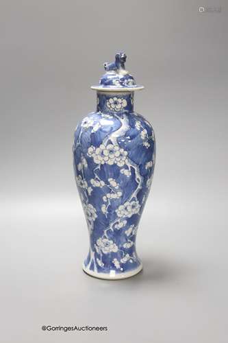 A 19th century Chinese blue and white 'prunus' vase and cove...