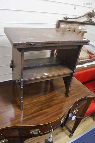 An early 20th century solid, dark oak occasional table with ...