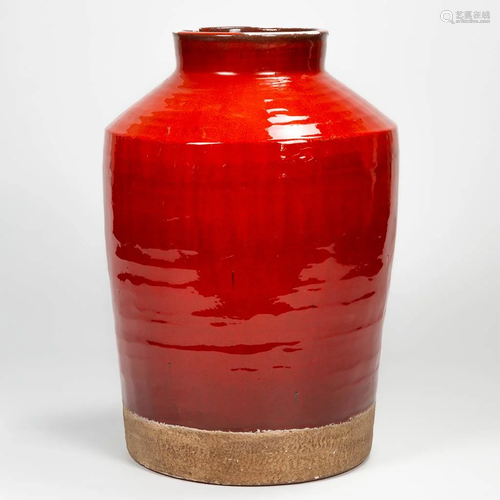 An exceptionally large ceramic vase with red glaze,