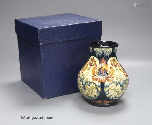 A boxed limited edition Moorcroft pottery vase in the Festiv...