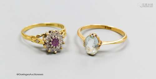 An 18ct gold diamond and pink stone cluster ring, size K and...