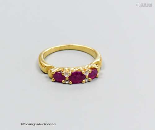 A 18ct gold ruby and diamond ring, size M, gross 5g.