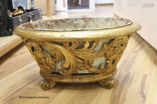 A carved wood and giltwood jardiniere, metal liner, length 5...