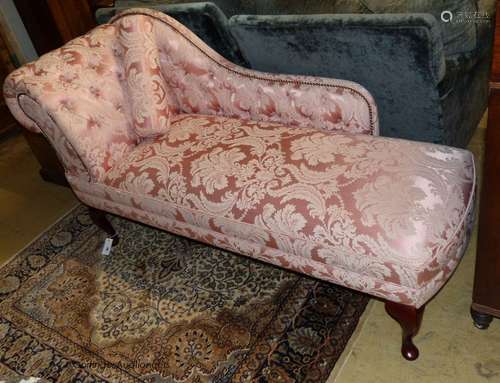 A Victorian style chaise longue upholstered in patterned pin...