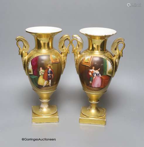 A pair of 19th century Paris porcelain vases, with winged sw...