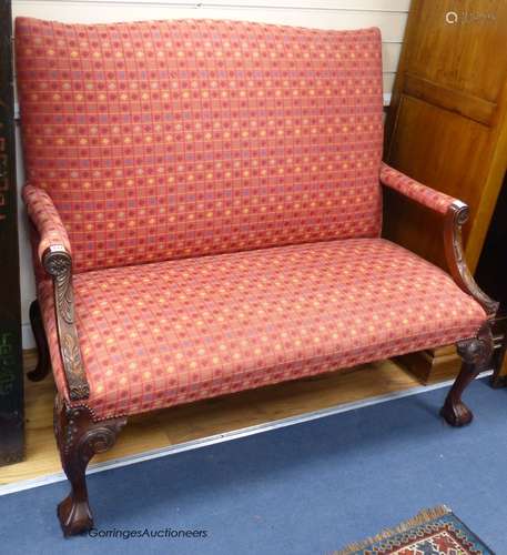 A George III style carved mahogany settee, on cabriole legs,...