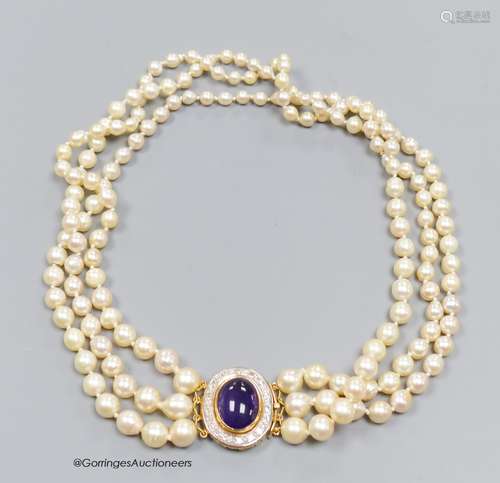 A three strand cultured pearl necklace with cabochon amethys...