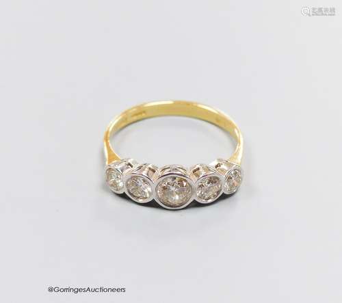 An 18ct gold five stone diamond ring, size T, gross 4.3g.App...