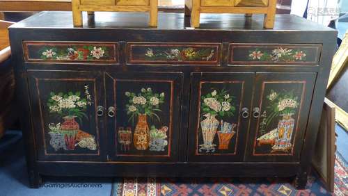 A Chinese black and polychrome painted dresser, fitted three...