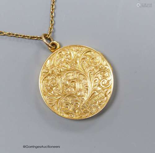 A 15ct engraved gold locket on a fine 9ct gold chain, 8.6g, ...