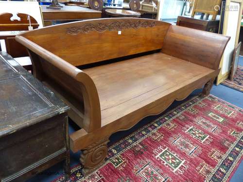 An Indian carved teak day bed, length 220cm, width 87cm, hei...