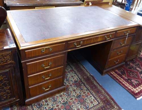 A George III style mahogany pedestal desk, length 152cm, dep...