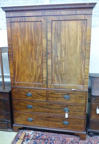 A George III mahogany linen press(lacking sliding trays), wi...