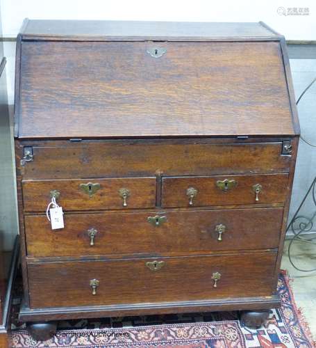 A mid-18th century oak bureau, width 84cm, depth 51cm, heigh...