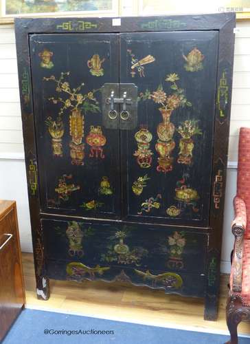 A Tibetan black and polychrome painted two door cabinet, wid...