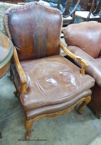 An 18th century style tan leather elbow chair, width 70cm, d...