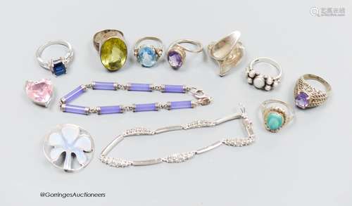 A group of white metal and gem set rings, pendants etc