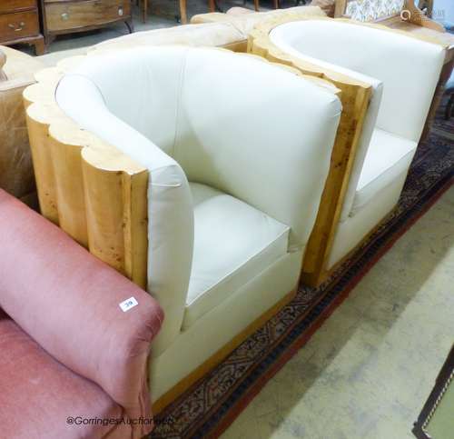 A pair of Art Deco style tub framed cream leather and maple ...