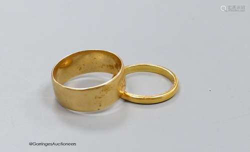 An 18ct. gold wedding band, size P, 5.9g, and a 22ct gold ba...