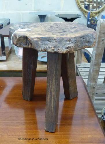 A provincial burr ash topped tripod stool, stamped Wanderwoo...