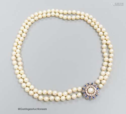 A two strand pearl necklace with sapphire and diamond set 14...