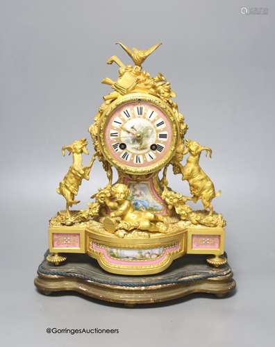 A 19th century French ormolu and porcelain mantel clock, wit...