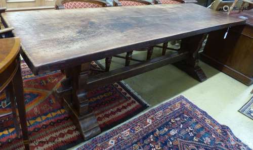 An 18th century style rectangular oak refectory dining table...