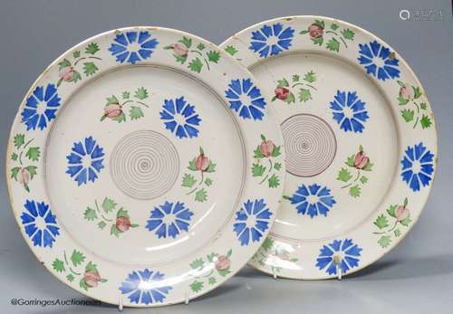 A pair of Continental polychrome faience chargers, late 19th...