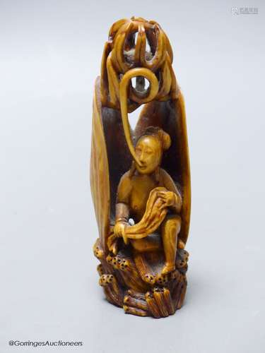 A Chinese ivory figure of a woman in a clam shell, 19th cent...