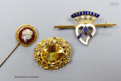 A Victorian gold and citrine brooch, 2.75cm. a hardstone cam...