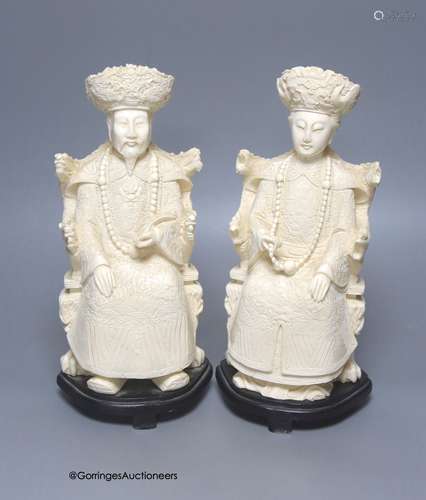 A pair of mid 20th century Chinese faux ivory figures of an ...