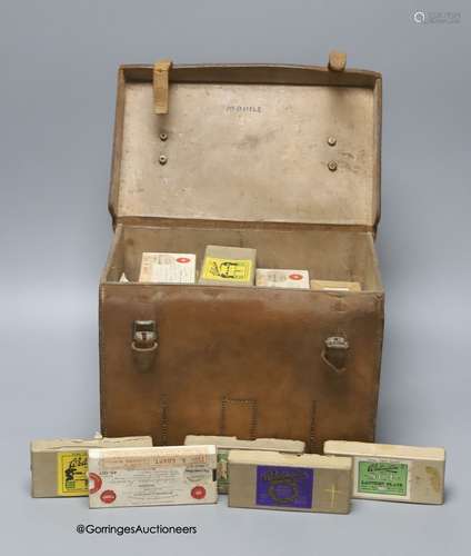 A leather case containing Magic lantern slides