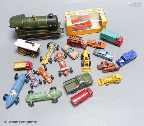 A mixed group of toy cars and an engine (railway)