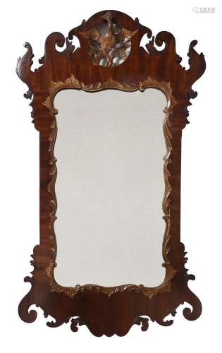 A GEORGE II WALNUT AND PARCEL GILT WALL MIRROR, CIRCA 1755