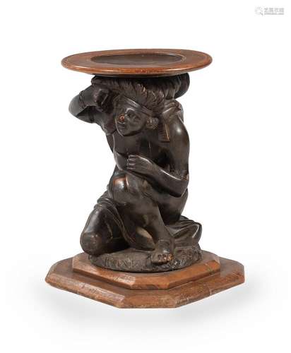 A CARVED WALNUT AND EBONISED FIGURAL TORCHERE STAND, MID 19T...