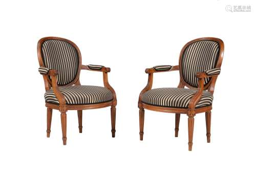 A PAIR OF WALNUT AND UPHOLSTERED FAUTEUILS, IN LOUIS XVI STY...