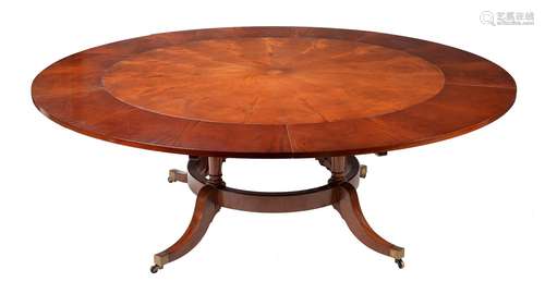 A MAHOGANY CONCENTRIC EXTENDING CIRCULAR DINING TABLE, IN GE...