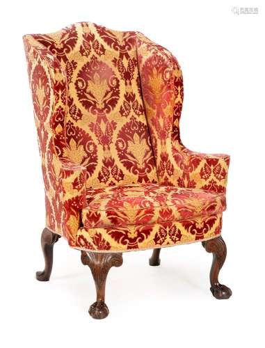 A GEORGE II MAHOGANY AND UPHOLSTERED WING ARMCHAIR, CIRCA 17...