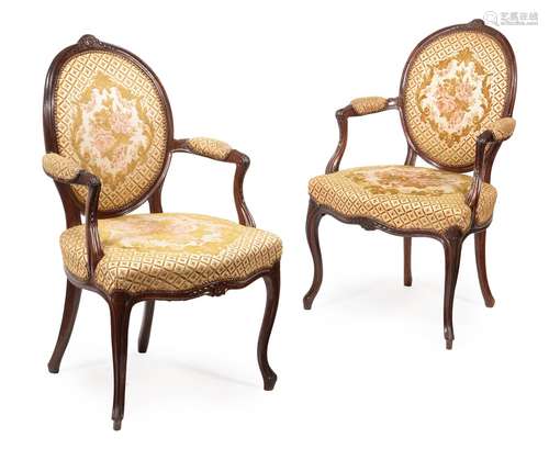 A SET OF EIGHT GEORGE III MAHOGANY AND UPHOLSTERED OPEN ARMC...