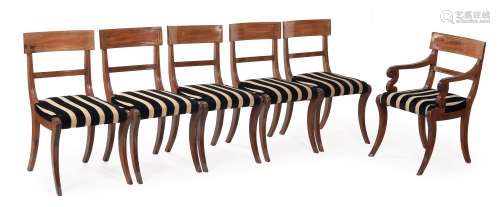 A SET OF FOURTEEN REGENCY MAHOGANY AND BRASS STRUNG DINING C...