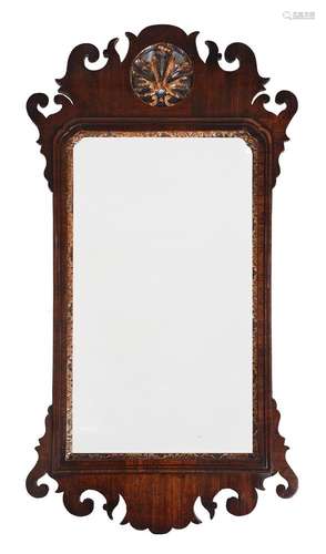 A GEORGE II WALNUT AND PARCEL GILT WALL MIRROR, CIRCA 1755