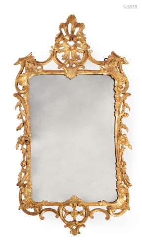 AN EARLY GEORGE III GILTWOOOD WALL MIRROR, IN THE MANNER OF ...