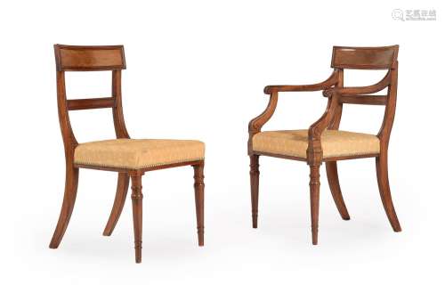 A SET OF TWELVE REGENCY MAHOGANY AND UPHOLSTERED DINING CHAI...