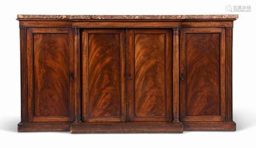 A GEORGE IV MAHOGANY BREAKFRONT SIDE CABINET, CIRCA 1825